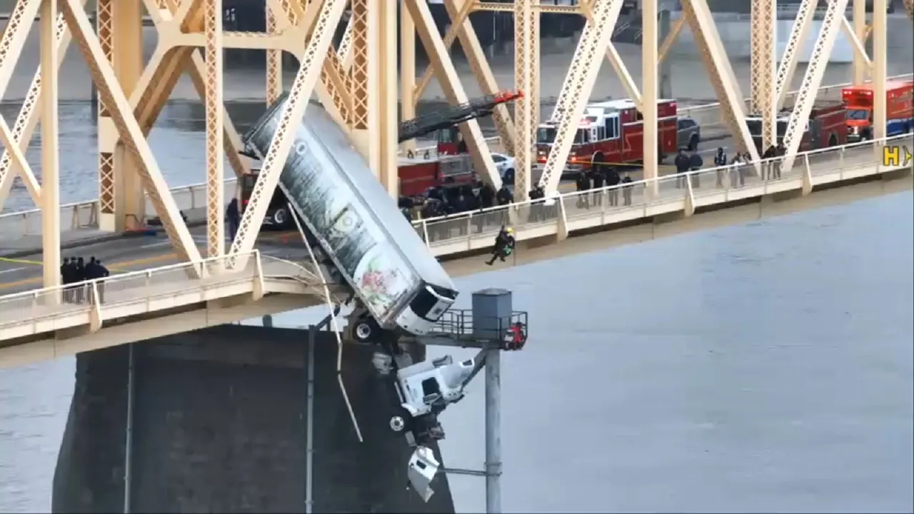 Pickup driver charged in crash that left trucker hanging off Louisville ...