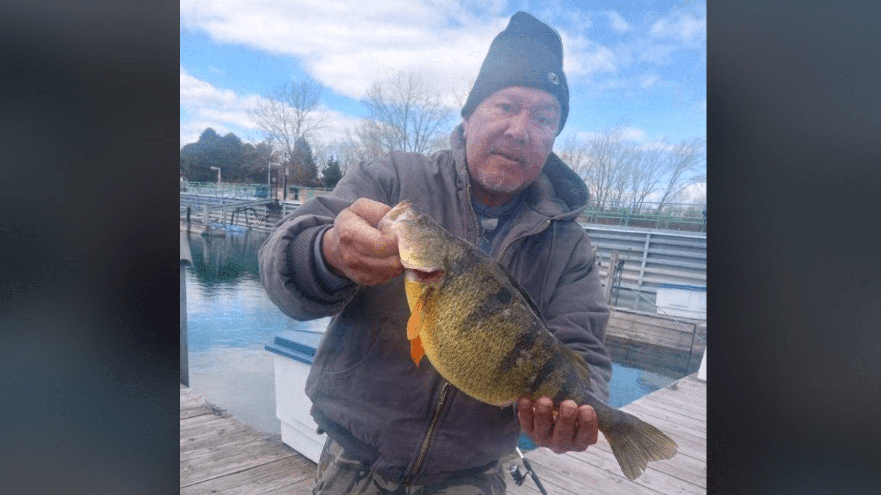 Angler breaks 43-year-old record after reeling in large perch in Lake ...