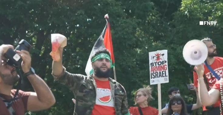 Anti-Israel agitator in Hamas headband holds up bloodied Biden face ...