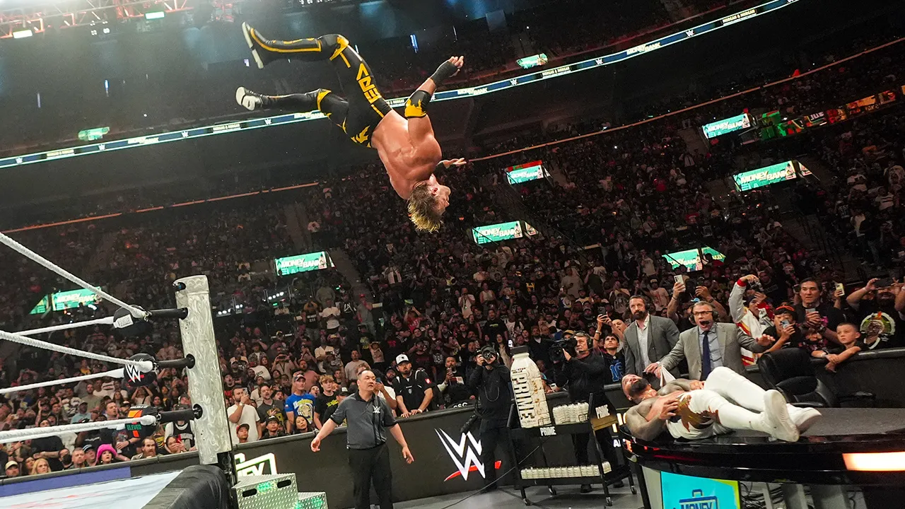 Logan Paul performs a moonsault on Jey Uso at WWE Money in the Bank 2025
