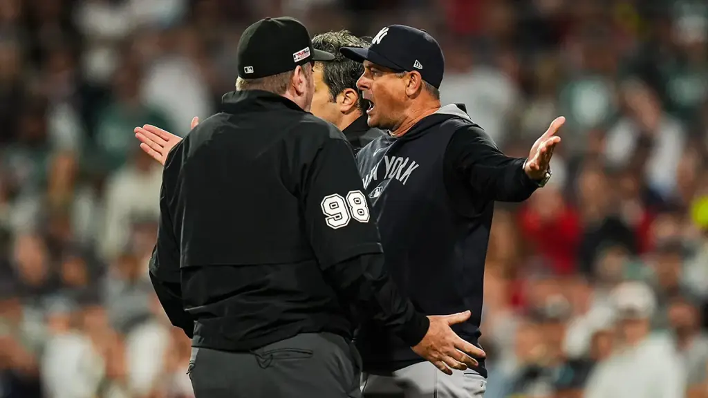 Aaron Boone of the Yankees throws gum in frustration over disputed foul ball decision