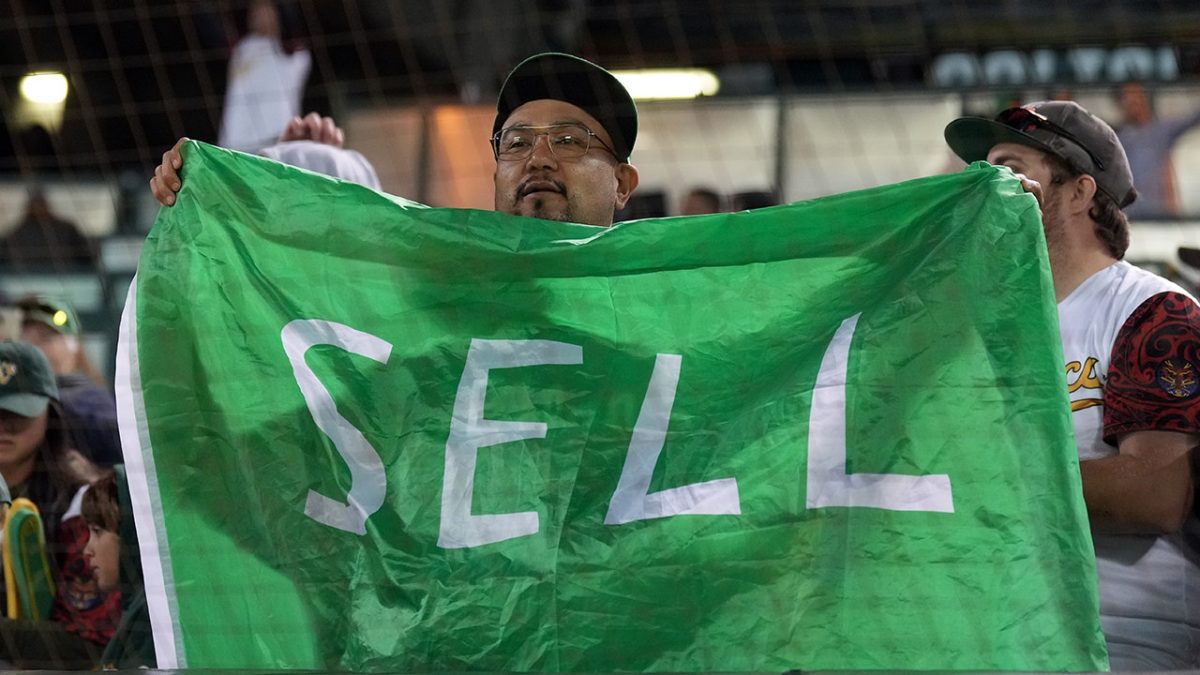 A's broadcast captures the moment a fan in a 'SELL' shirt was approached by security.