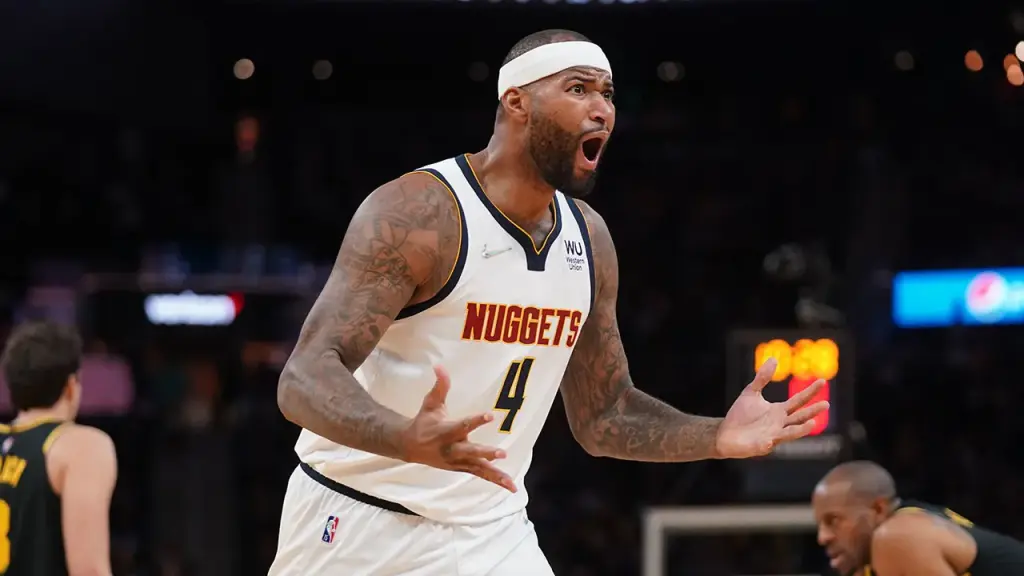 DeMarcus Cousins almost clashes with fans after drinks are thrown following his ejection.