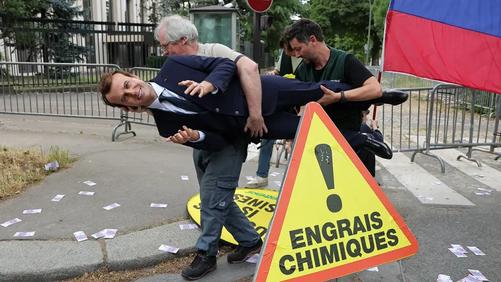 Greenpeace takes Macron wax figure to protest France's connection with Russia
