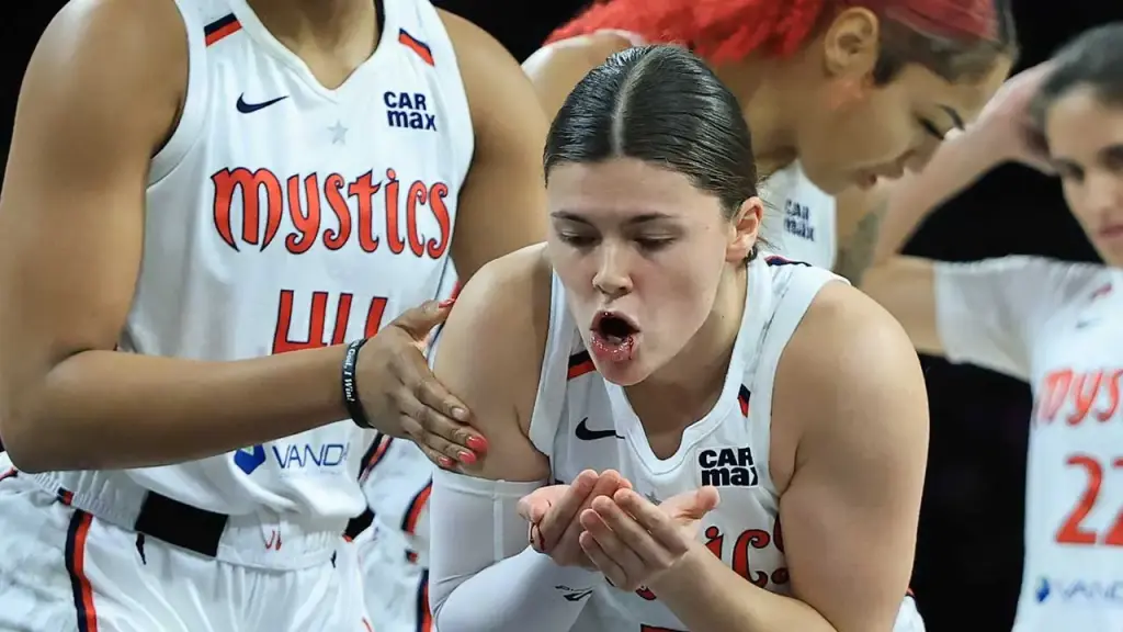 Jade Melbourne from the Mystics loses a front tooth due to an elbow from Chelsea Gray