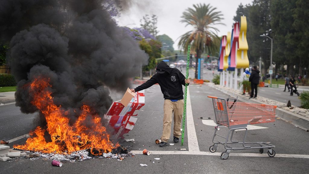 Media described the violent Los Angeles riots as 'largely peaceful' despite looting and arson.