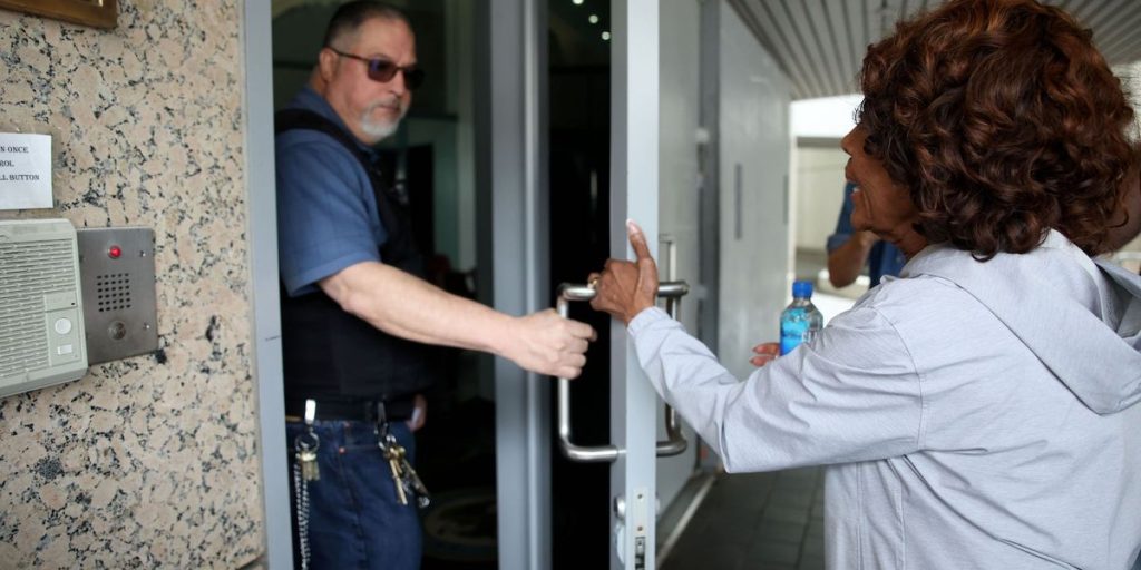 Officer shuts door on Rep. Maxine Waters as she attempts to visit arrested union president following ICE protests