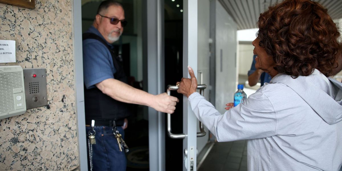 Officer shuts door on Rep. Maxine Waters as she attempts to visit arrested union president following ICE protests