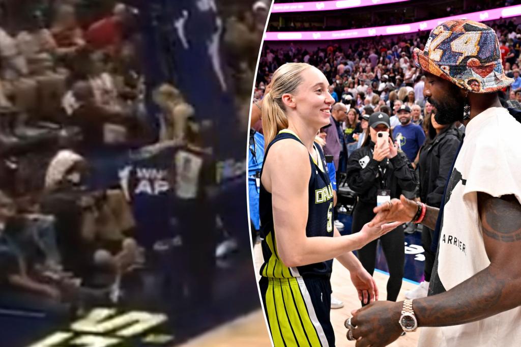 Paige Bueckers has a moment with Kyrie Irving during the game
