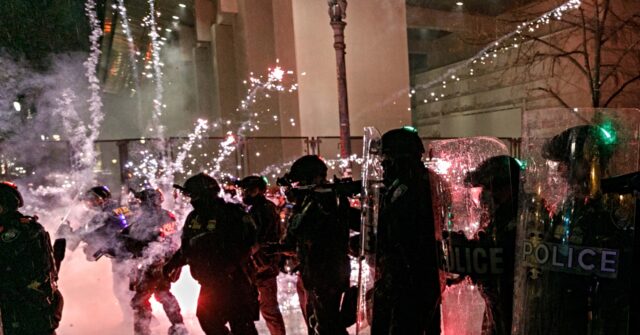 Protesters Aim Fireworks and Explosives at Federal Officers