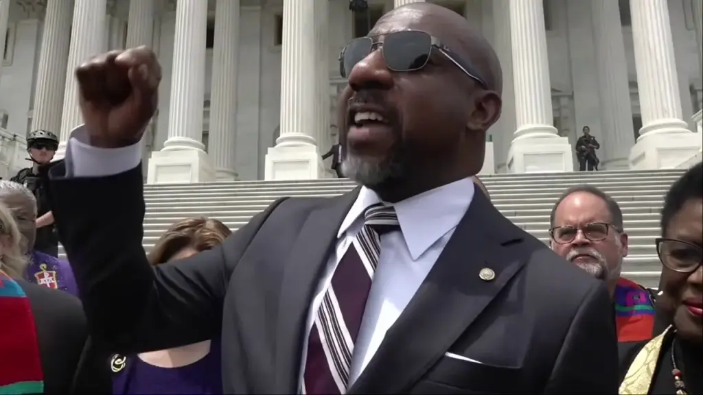 Raphael Warnock leads a prayer vigil opposing the Big Beautiful Bill