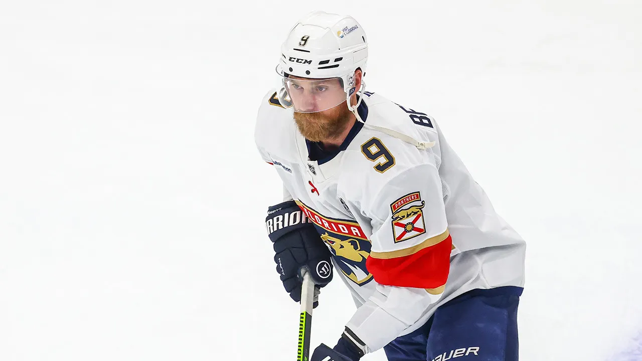 Sam Bennett of the Panthers receives the Conn Smythe Trophy as the most valuable player of the Stanley Cup Playoffs