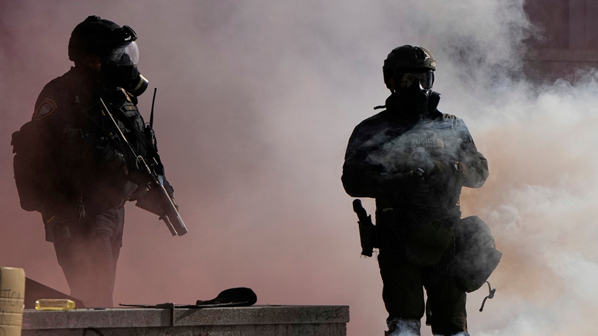 Several police officers hurt in chaotic Portland protest at ICE center