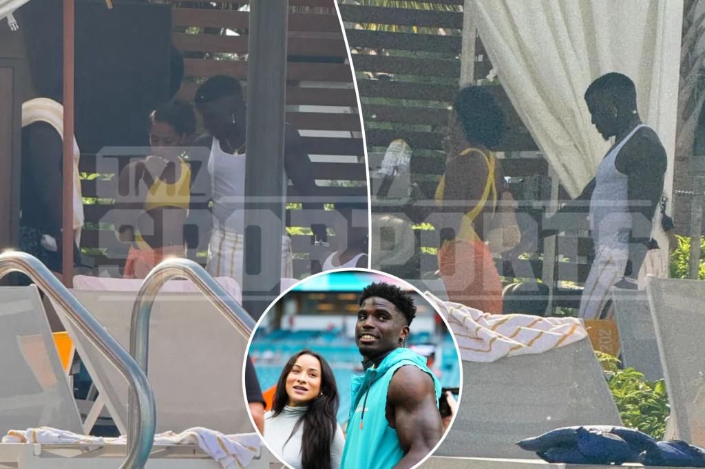 Tyreek Hill flirts with unknown woman in pool after his wife files for divorce