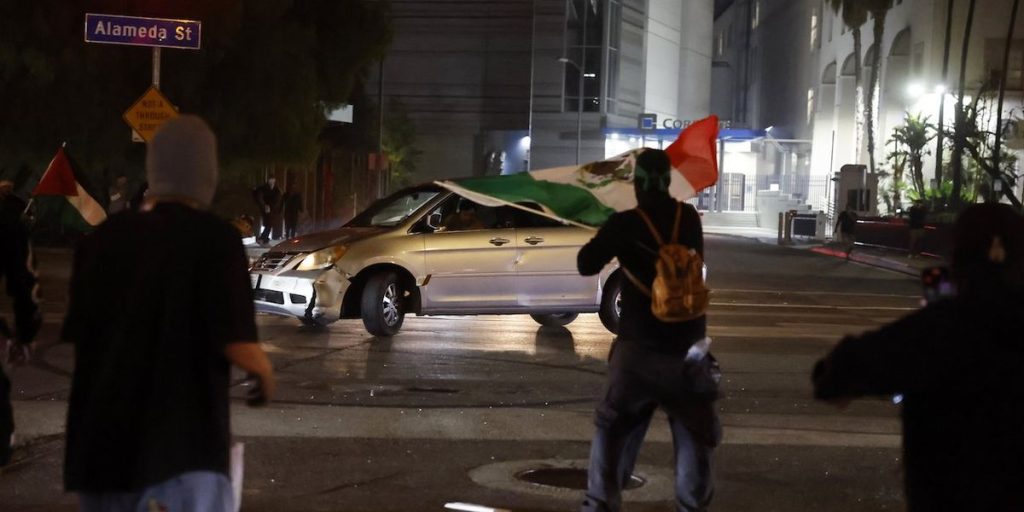 Why did the reckless LA minivan driver perform 'street takeover' donuts during the riots and get hit by protesters?
