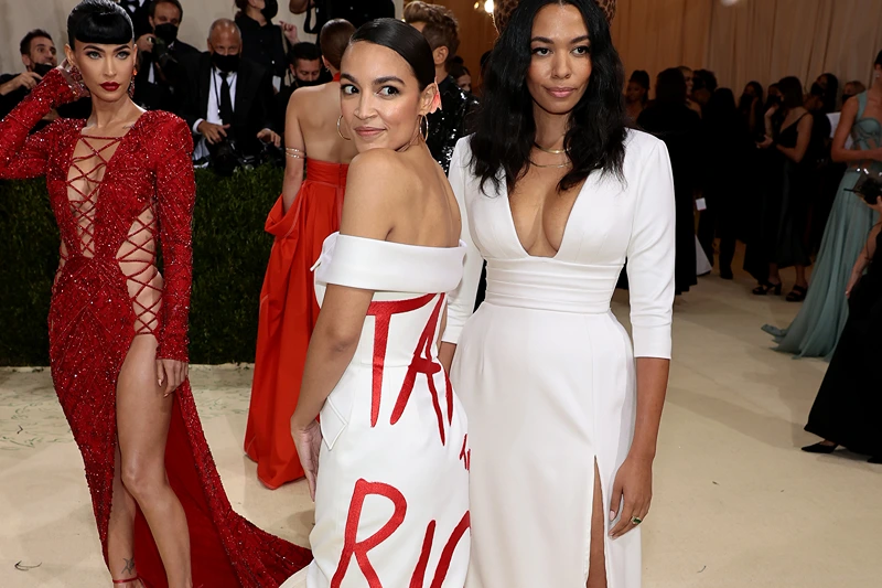 AOC violated House rules and owes more than $2,700 for the 'Tax The Rich' dress she wore at the Met Gala.