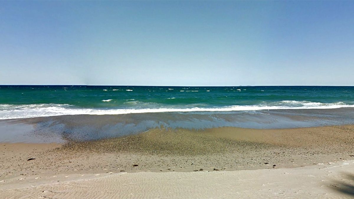 Australian surfer located safe on island far from shore after search