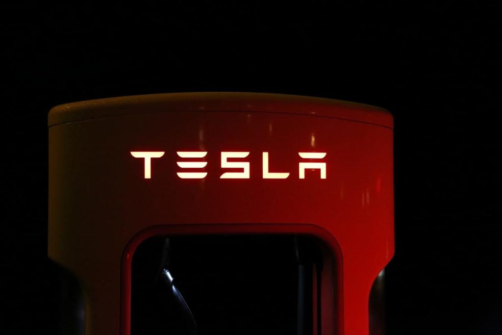 Cathie Wood is purchasing Tesla stock after its earnings drop. Should you consider it?