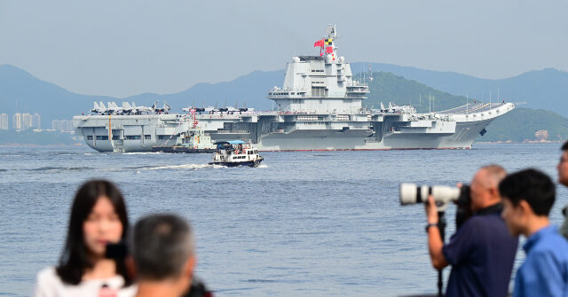China Shows Military Strength with Aircraft Carrier Arrival in Hong Kong