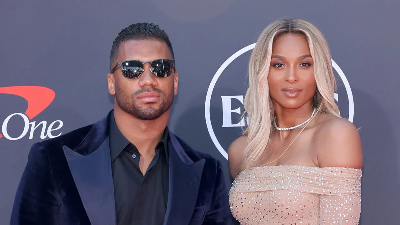 Ciara and their kids cheer on Russell Wilson at his first Giants training camp.