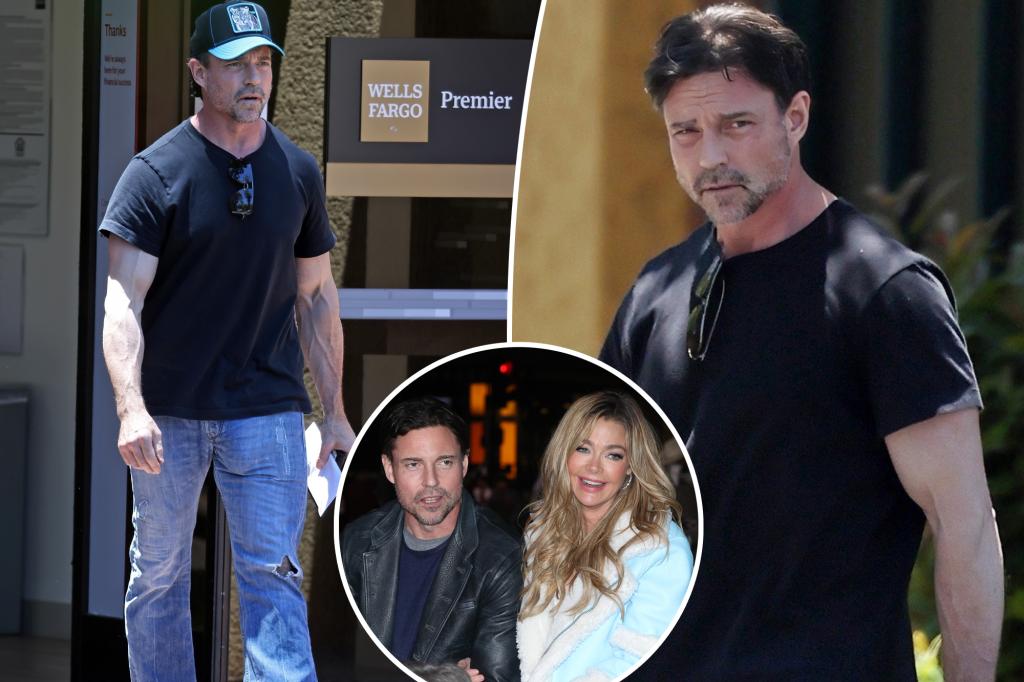 Denise Richards' soon-to-be ex-husband, Aaron Phypers, removes his wedding ring during his first public appearance after filing for divorce.