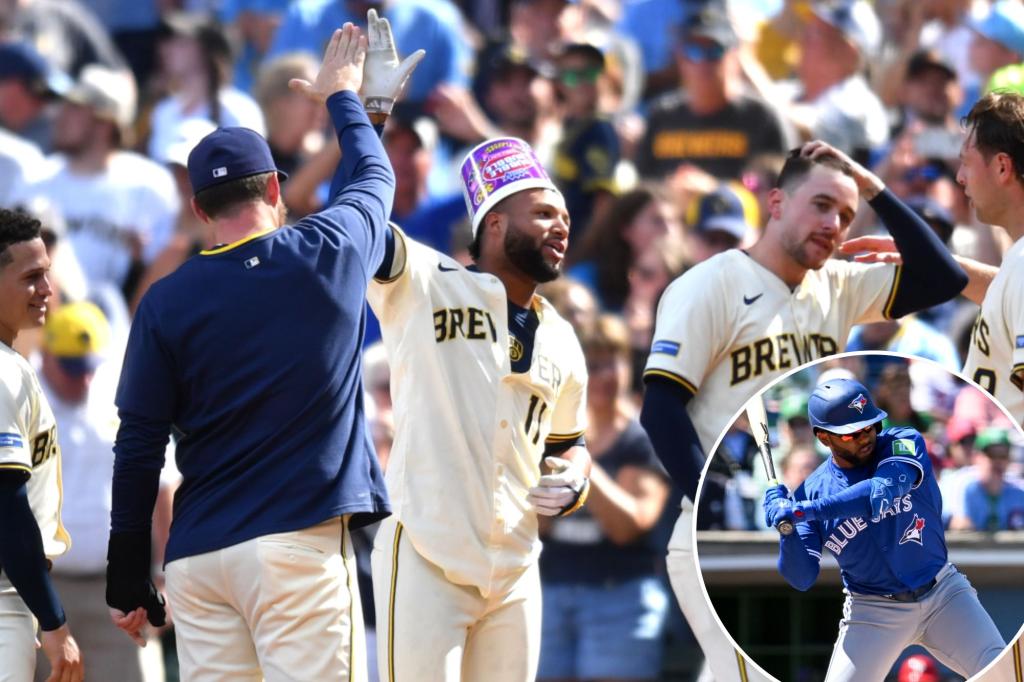 Dodgers and Brewers trade players during their game.