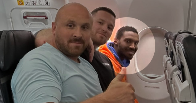 Fugitive Caught Smiling with Officers After Extended Search