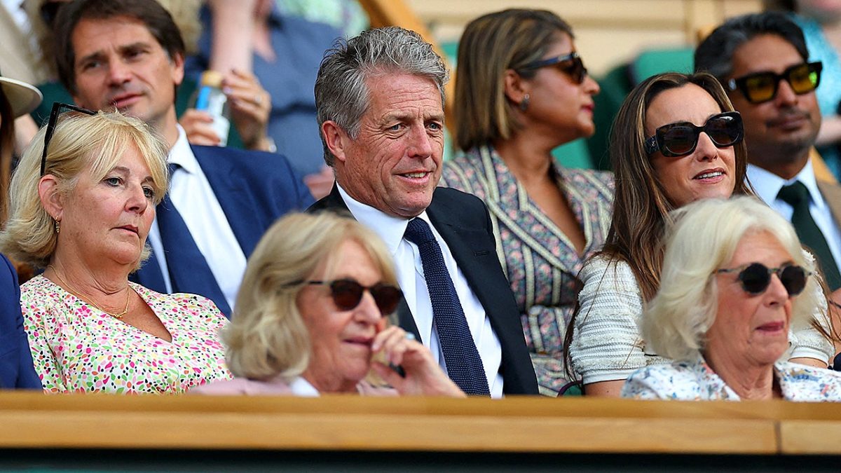 Hugh Grant appears to be sleeping behind Queen Camilla at Wimbledon.