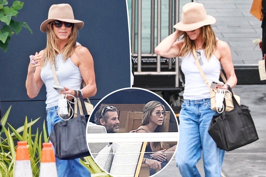Jennifer Aniston is beaming following her holiday in Mallorca with Jim Curtis.