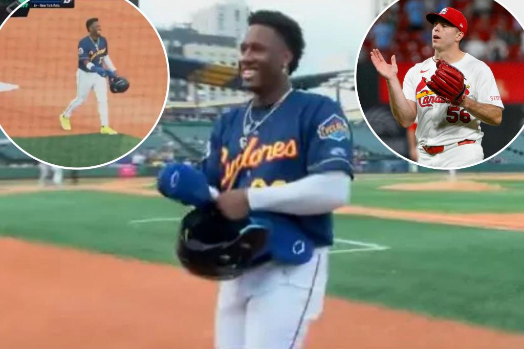 Jesus Baez learns he's part of the Ryan Helsey trade while on base.