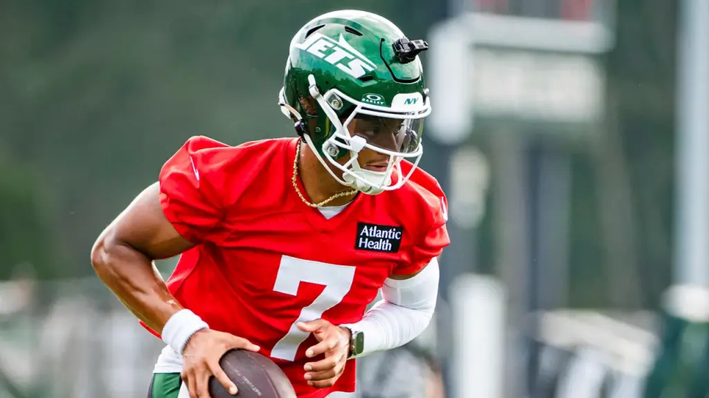 Justin Fields takes part in training camp drills following a successful recovery from injury