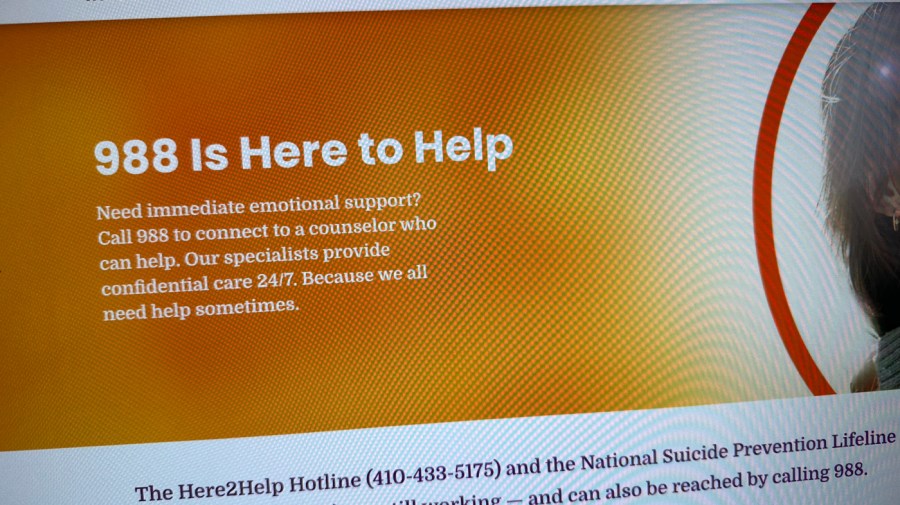 LGBTQ supporters prepare for the shutdown of the 988 lifeline service on Thursday.