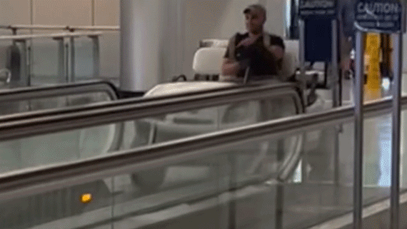 Man operates a stolen cart on a moving walkway at Buffalo airport in popular video