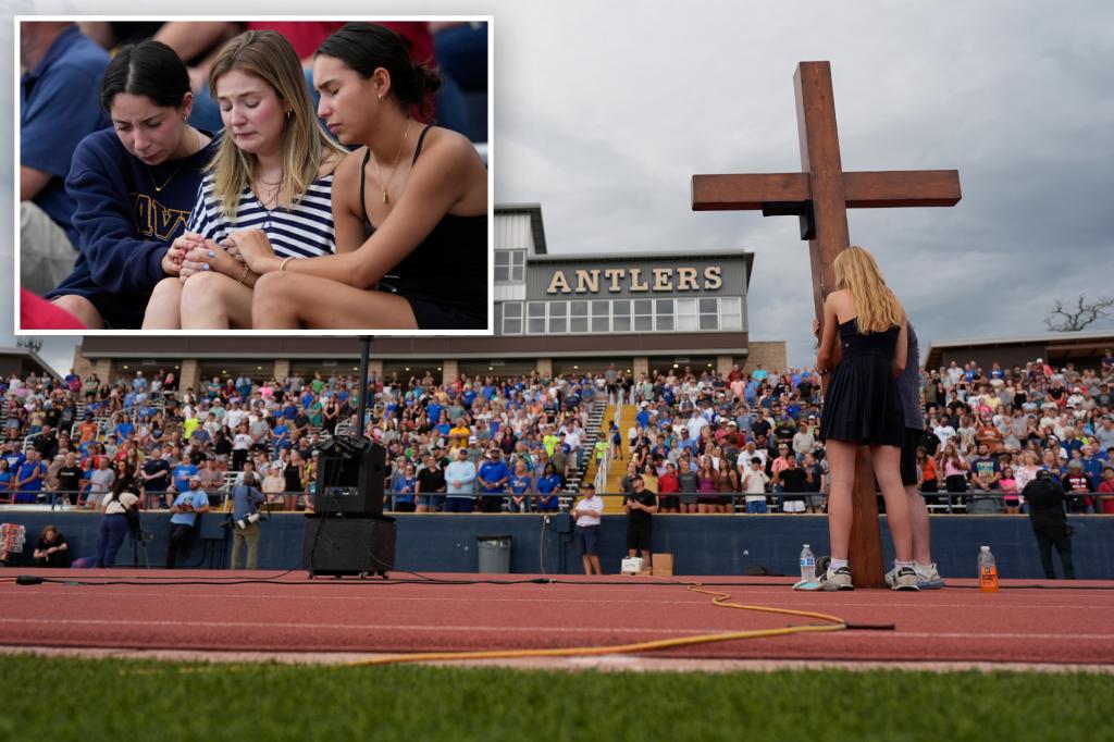 Many come together at a Texas high school stadium to pay tribute to flood victims