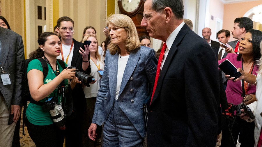 Murkowski expresses sadness over the difficult journey to support the GOP tax bill.