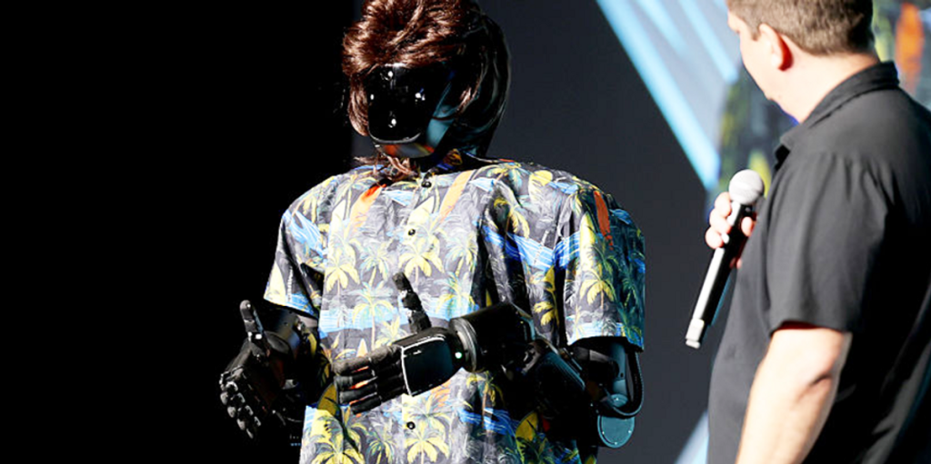 Palmer Luckey shows up at a conference as a robot controlled by VR.