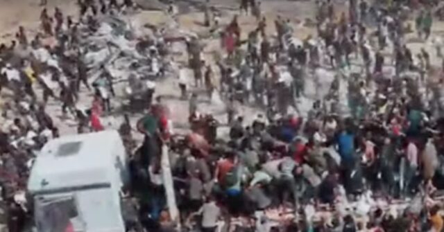 People in Gaza Take Supplies from UN Aid Trucks