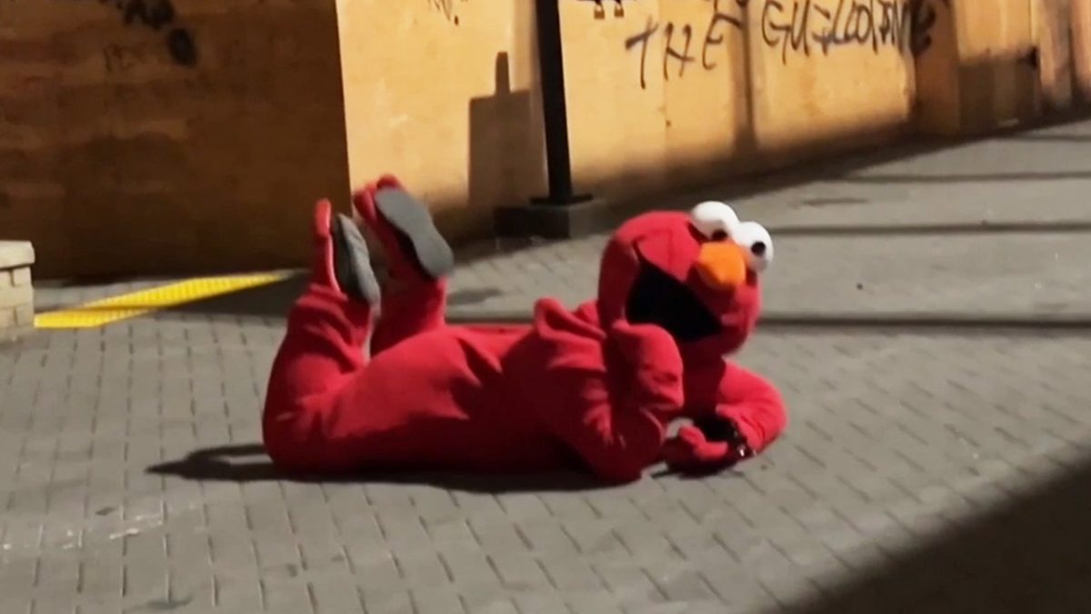 Person in an Elmo costume faces off against Antifa at the ICE camp in Portland