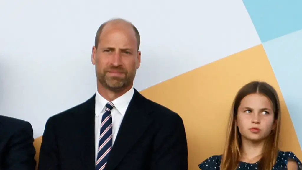 Prince William brings Princess Charlotte to her first international soccer game.