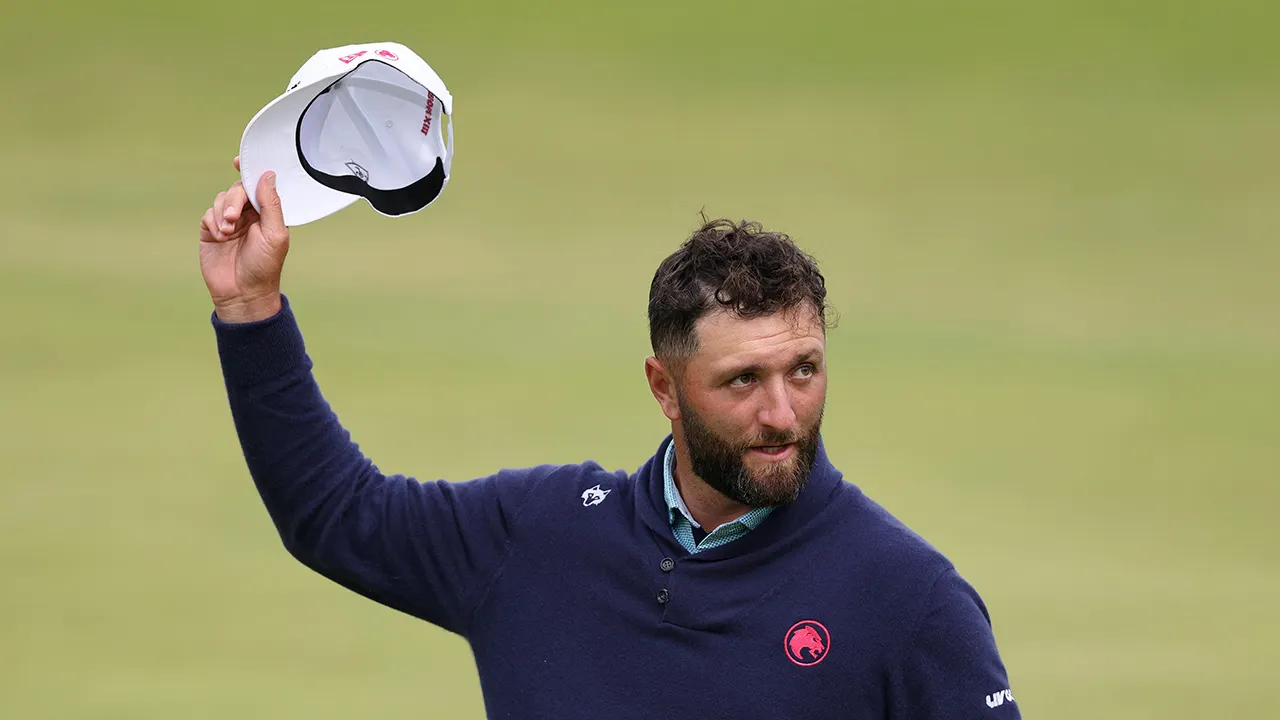Pro golfer Jon Rahm addresses a fan during The Open Championship