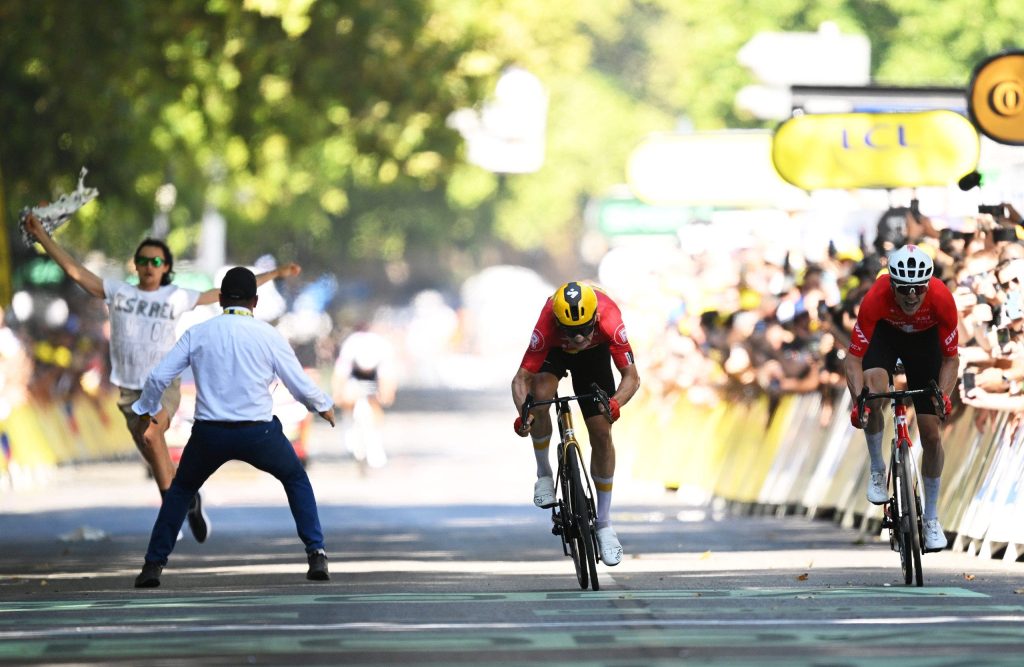 Protester against Israel subdued by security at the Tour de France finish line