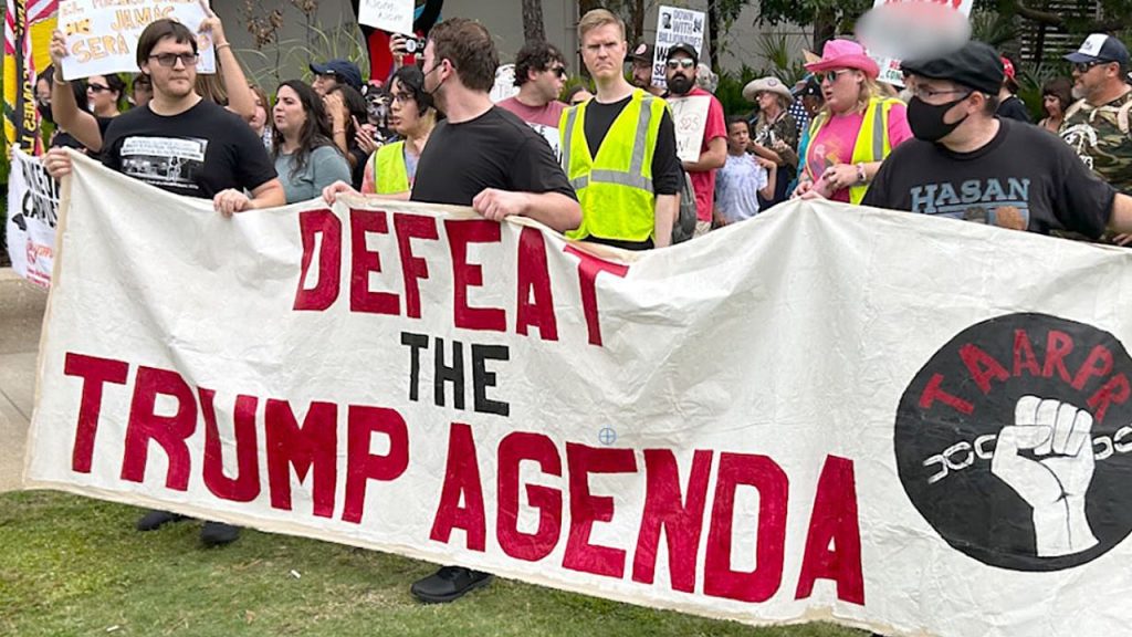 Protesters against ICE confront participants at the TPUSA summit in Tampa