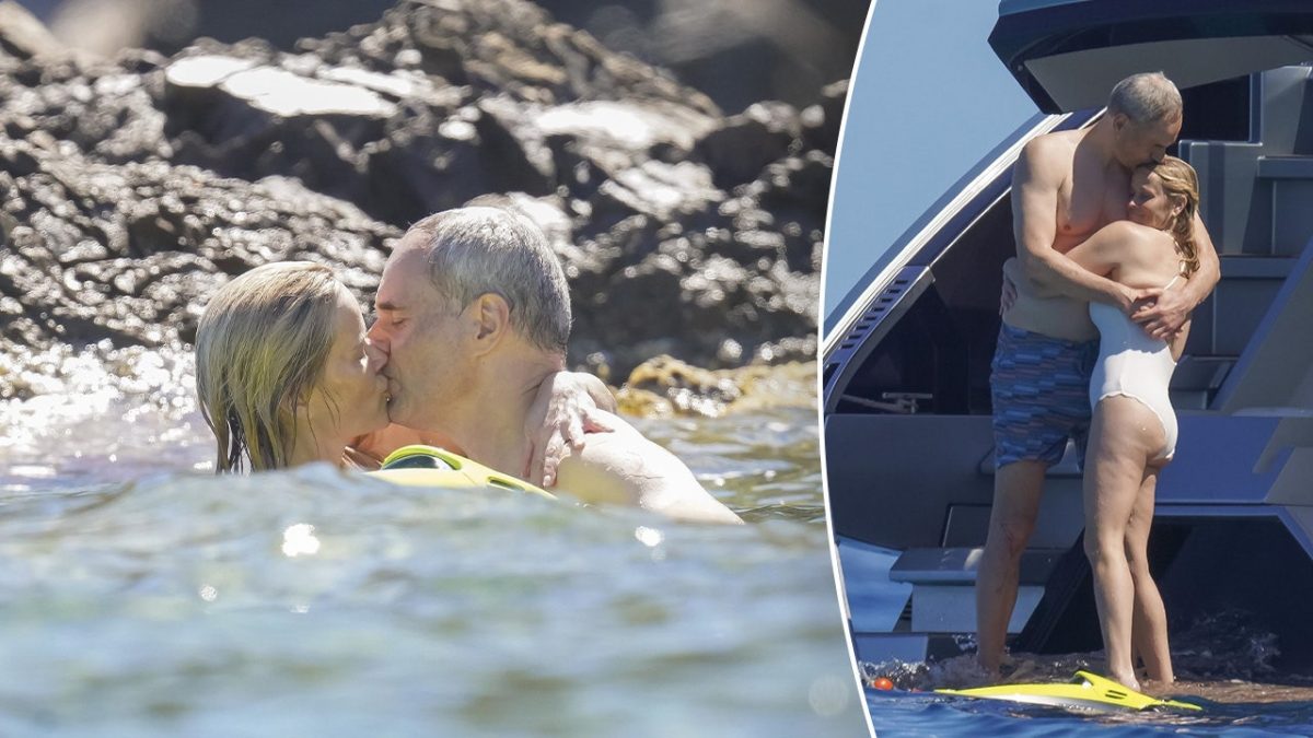 Reese Witherspoon shows affection with her boyfriend on a luxury yacht.