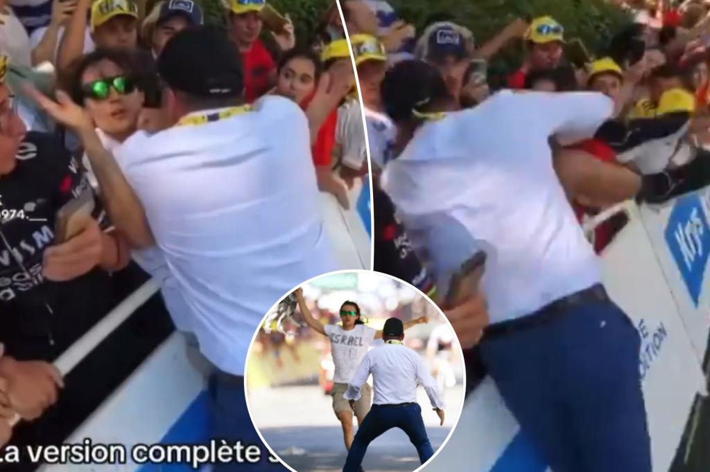 Security guard confronts protester during chaotic moment at Tour de France