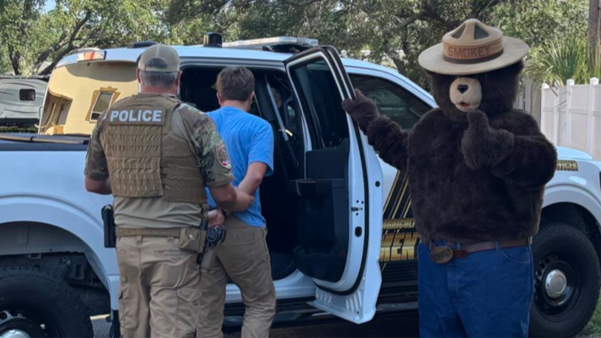 Smokey the Bear apprehends a man for supposedly taking his signs in Florida to sell on Facebook.