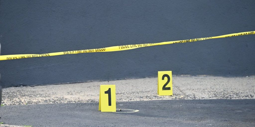 Surveillance footage reveals armed citizen stopping shooter on crowded city sidewalk — authorities claim he prevented numerous fatalities