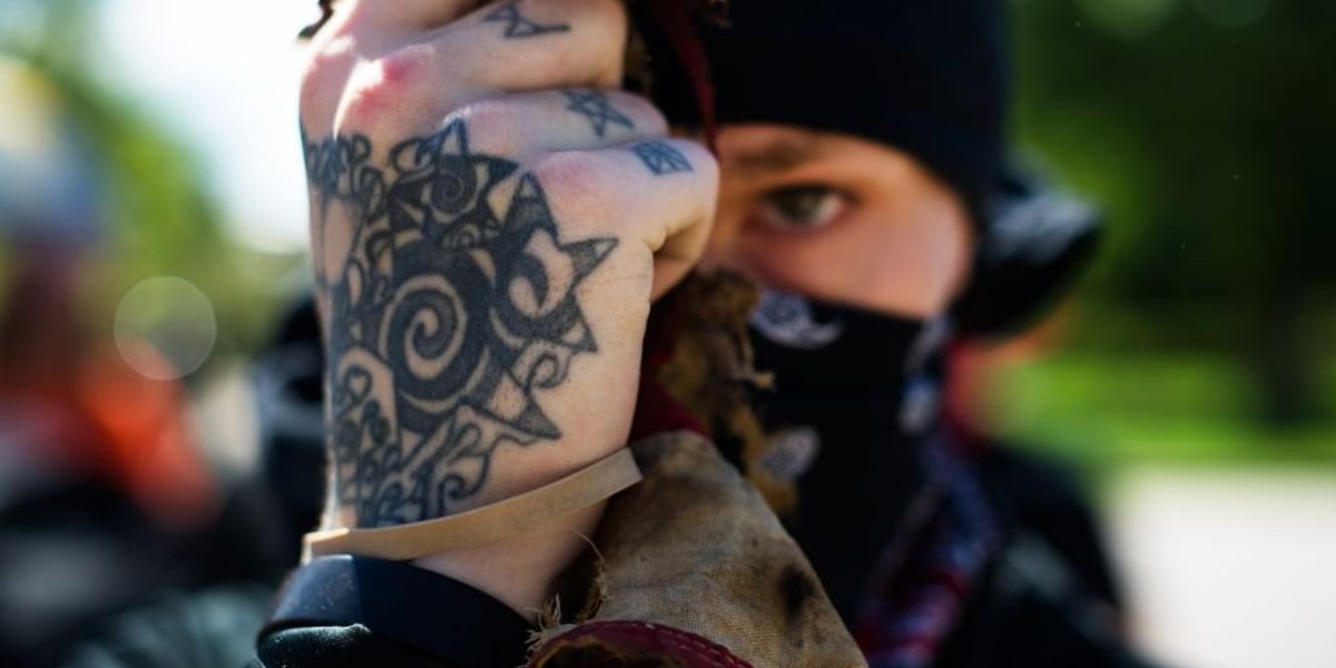 What do you refer to as 12 Antifa activists in protective gear?