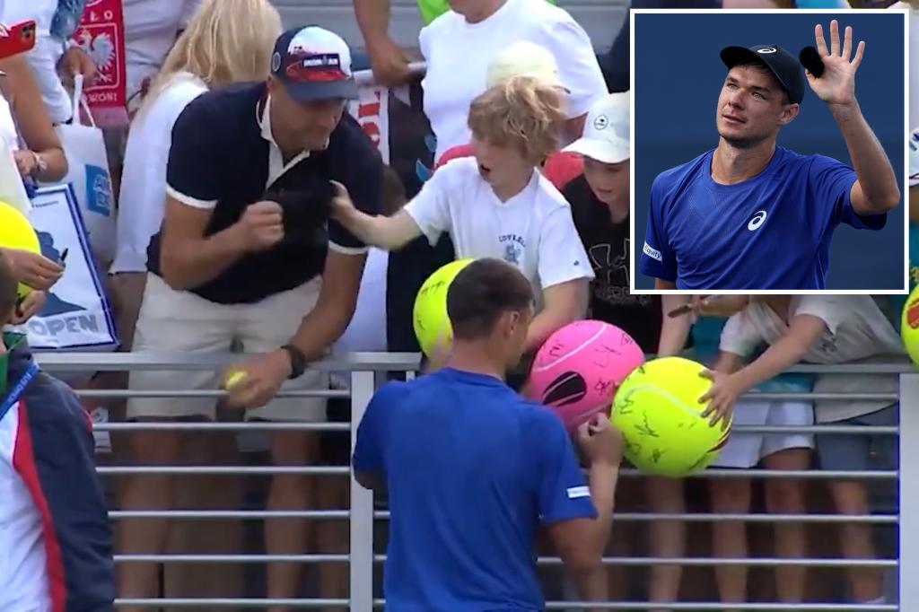 Adult criticized for taking Kamil Majchrzak's hat from a child