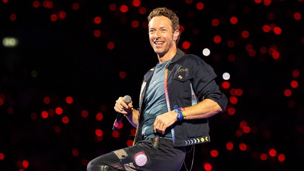 Chris Martin assists fan in proposing during Coldplay concert after cheating incident