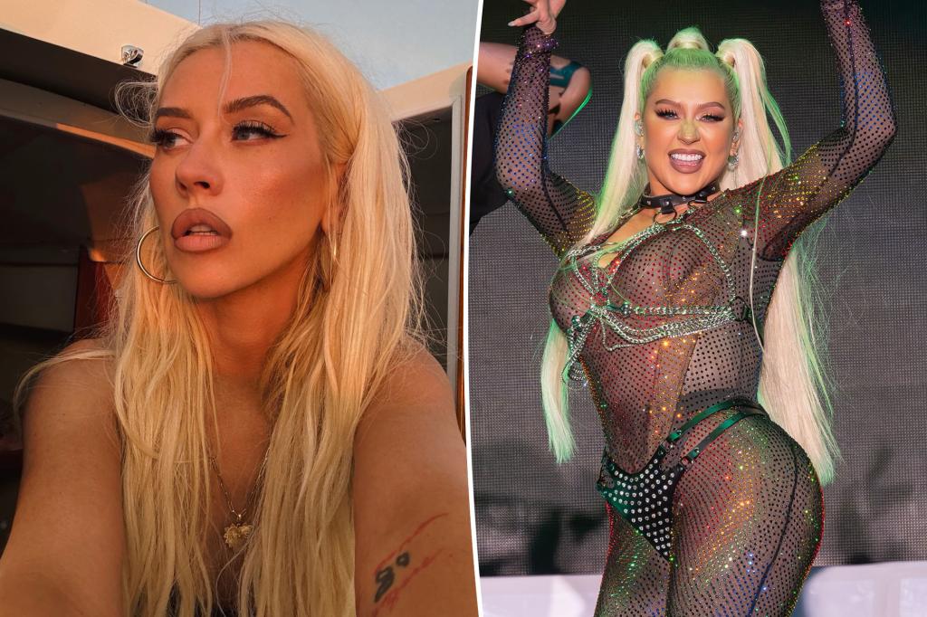 Christina Aguilera stuns in a vibrant red swimsuit after addressing Ozempic speculation.